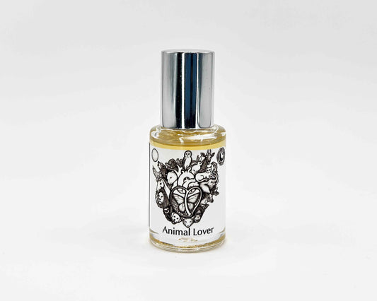 Animal Lover Fragrance 5mL bottle. Cylindrical clear glass with Animal Lover Collection artwork label and a cylindrical silver top.