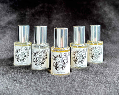 All five Animal Lover Collection 5 mL bottles lined up on a furry blanket.