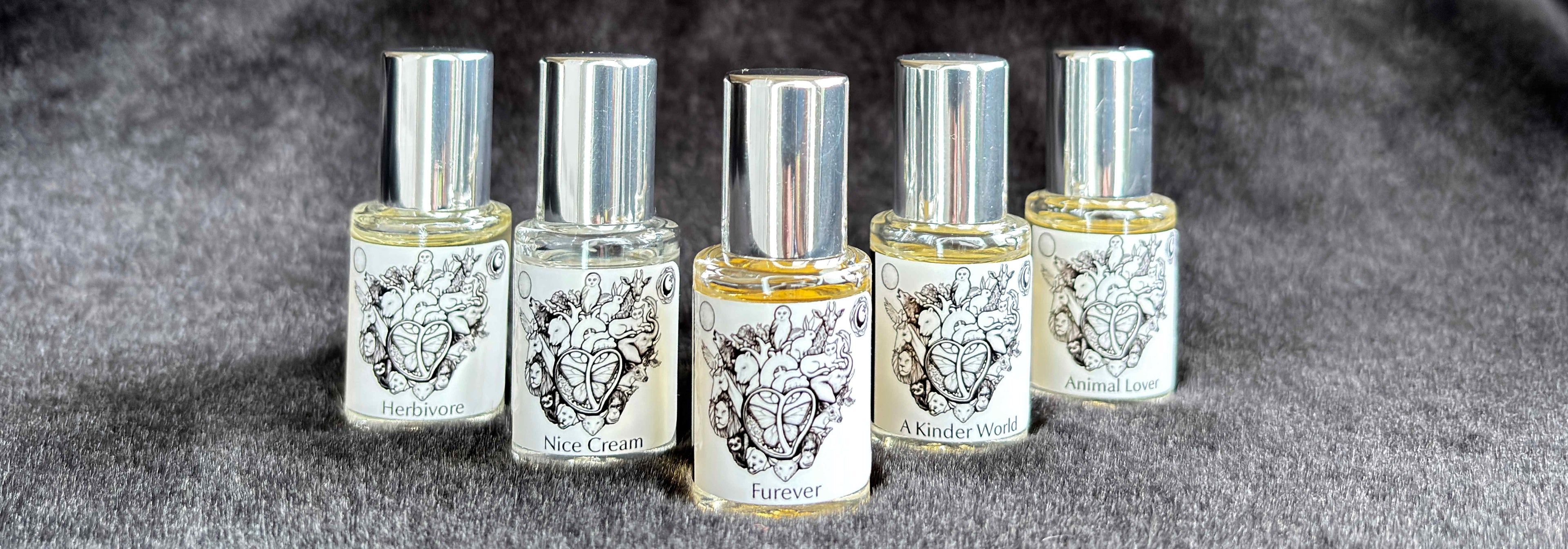 All five Animal Lover Collection 5 mL bottles lined up on a furry blanket.