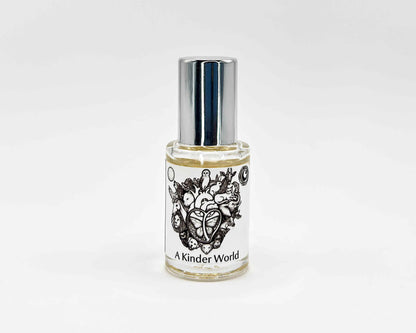 A Kinder World Fragrance 5mL bottle. Cylindrical clear glass with Animal Lover Collection artwork label and a cylindrical silver top.