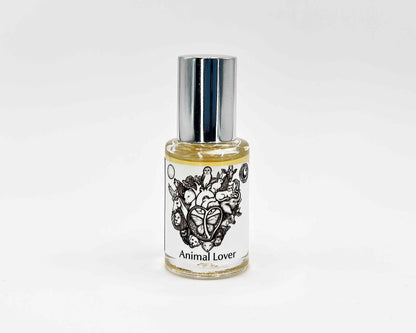 Animal Lover Fragrance 5mL bottle. Cylindrical clear glass with Animal Lover Collection artwork label and a cylindrical silver top.
