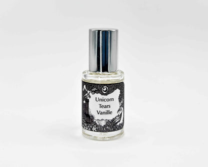 Unicorn Tears Vanille Fragrance 5mL bottle. Cylindrical clear glass with Lost Fairytale Collection artwork label and a cylindrical silver top.